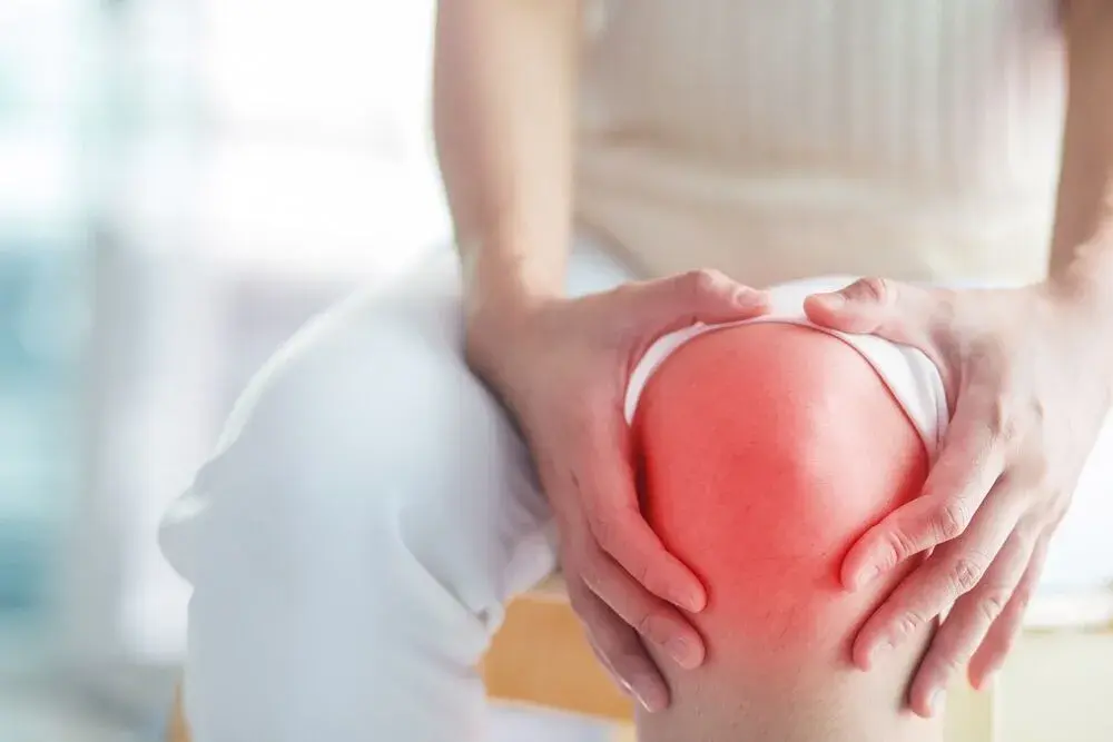 Illustration of a PRP injection being administered into a knee joint.