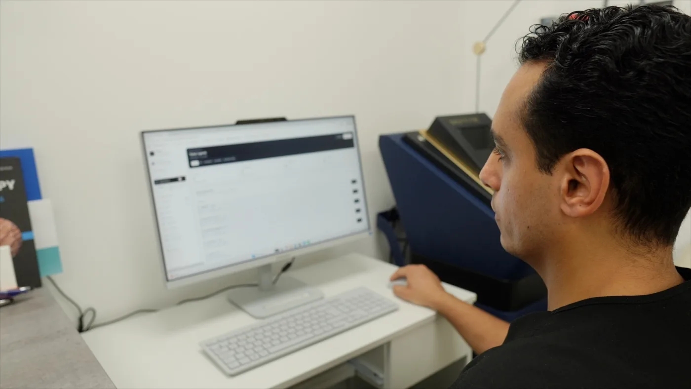 Clinician reviewing a completed patient treatment record on a desktop screen at PRP London Clinic